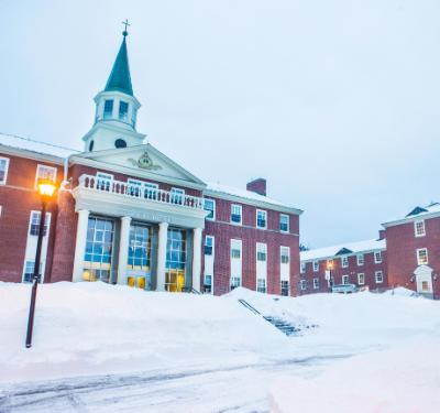 A snowy campus at dusk