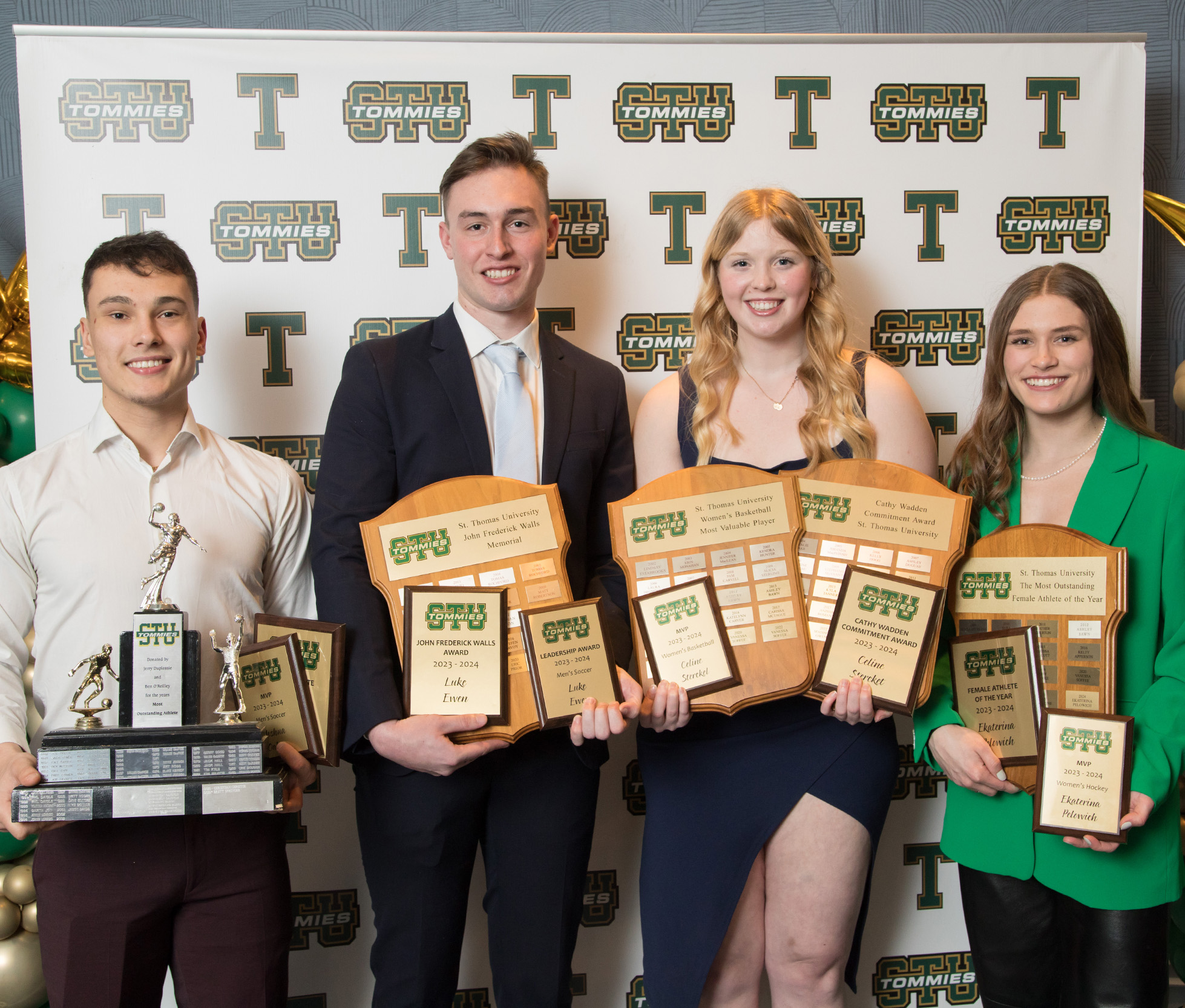 four student athletes with awards