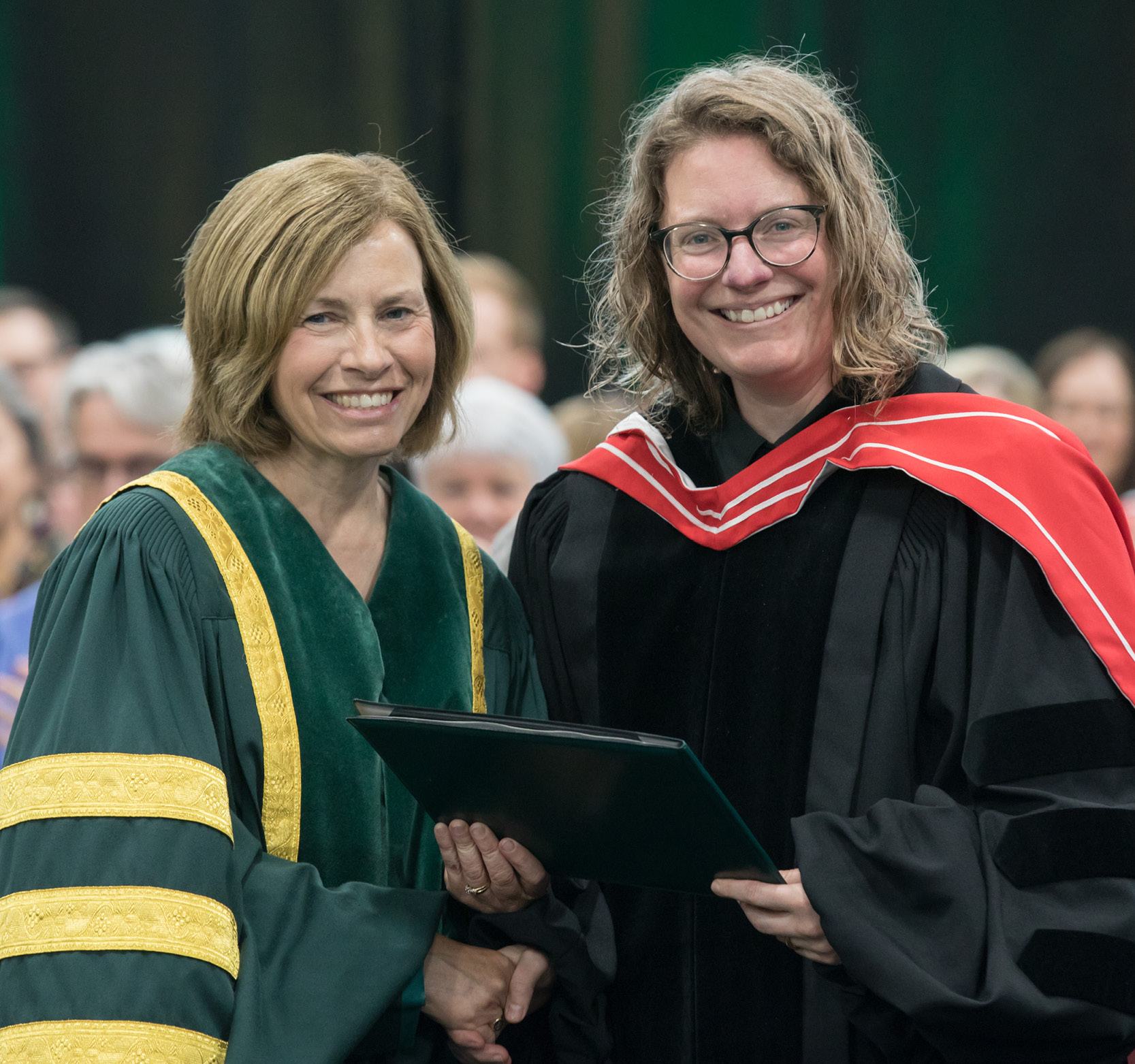 Dr. Erin Fredericks receiving the Dr. John McKendy Excellence in Teaching Award in 2023
