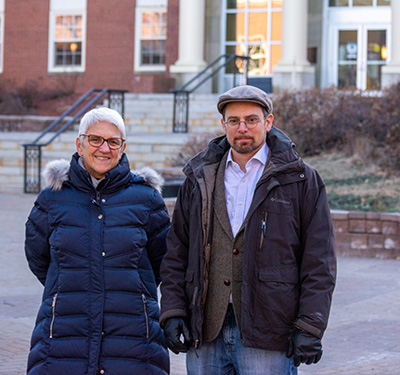Dr. Janice Harvey, left and Dr. Matt Robinson, right, stand in front of George Martin Hall